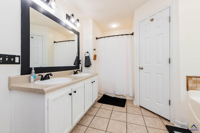 330 Hidden Creek Cir, Warner Robins, GA 31088 - full bath featuring double vanity, tile patterned flooring, and a bath
