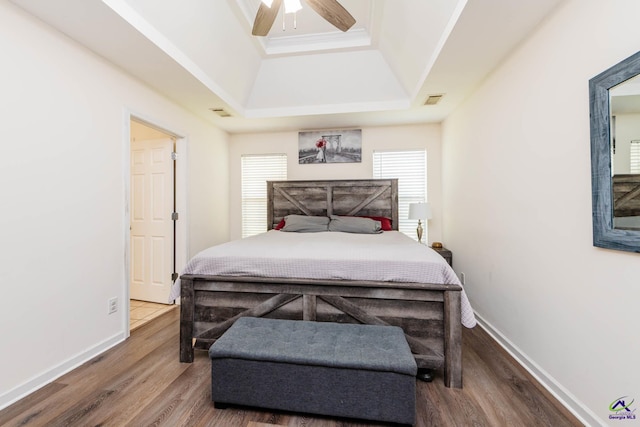330 Hidden Creek Cir, Warner Robins, GA 31088 - bedroom featuring wood finished floors, a raised ceiling, and a ceiling fan