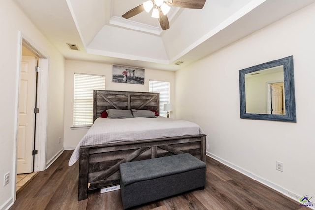 330 Hidden Creek Cir, Warner Robins, GA 31088 - bedroom with a tray ceiling, wood finished floors, and a ceiling fan