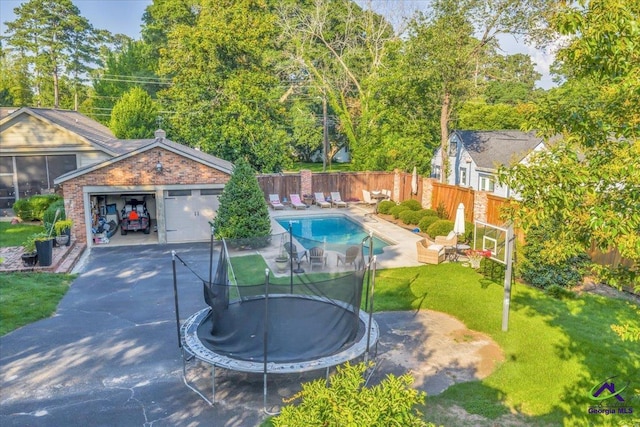 709 Evergreen St, Perry, GA 31069 - view of swimming pool with a trampoline