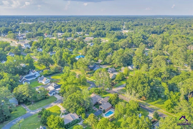 709 Evergreen St, Perry, GA 31069 - aerial overview of property's location with a forest