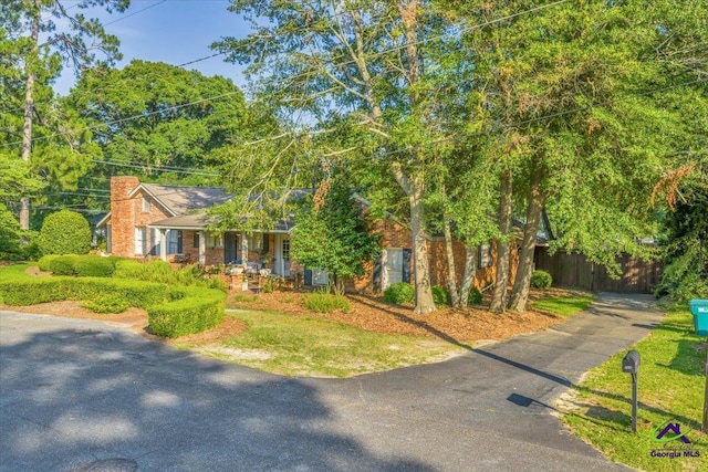 709 Evergreen St, Perry, GA 31069 - view of front facade with a chimney