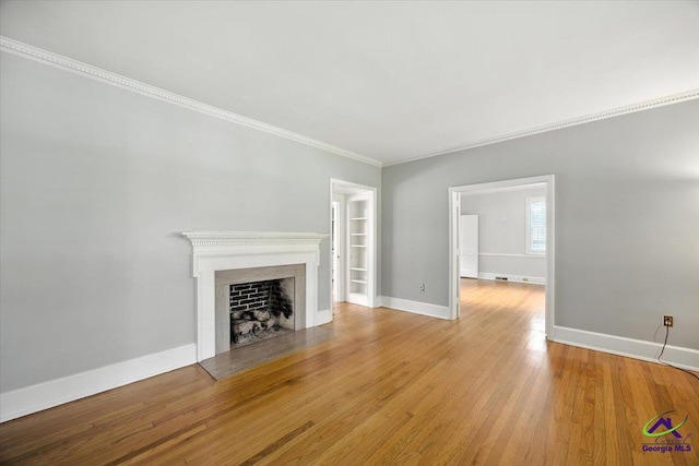 458 Pierce Ave, Macon, GA 31204 - unfurnished living room with a fireplace, wood finished floors, and ornamental molding