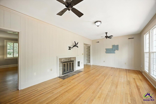 458 Pierce Ave, Macon, GA 31204 - unfurnished living room with ceiling fan, light wood finished floors, healthy amount of natural light, a fireplace, and ornamental molding