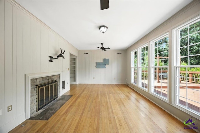 458 Pierce Ave, Macon, GA 31204 - unfurnished living room with a ceiling fan, wood finished floors, plenty of natural light, and a fireplace