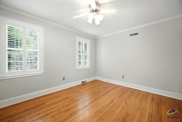 458 Pierce Ave, Macon, GA 31204 - spare room featuring light wood-style floors, ceiling fan, and ornamental molding