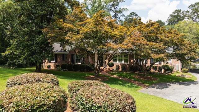 458 Pierce Ave, Macon, GA 31204 - obstructed view of property featuring a front yard and brick siding