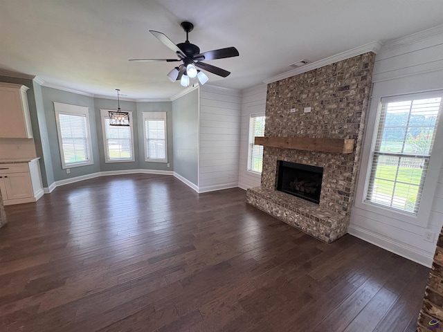 300 Stacy Ln, Warner Robins, GA 31088 - unfurnished living room with a fireplace, dark wood-style flooring, a ceiling fan, and ornamental molding