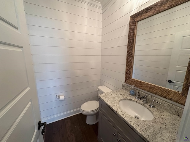 300 Stacy Ln, Warner Robins, GA 31088 - half bathroom with wood finished floors, vanity, and wood walls