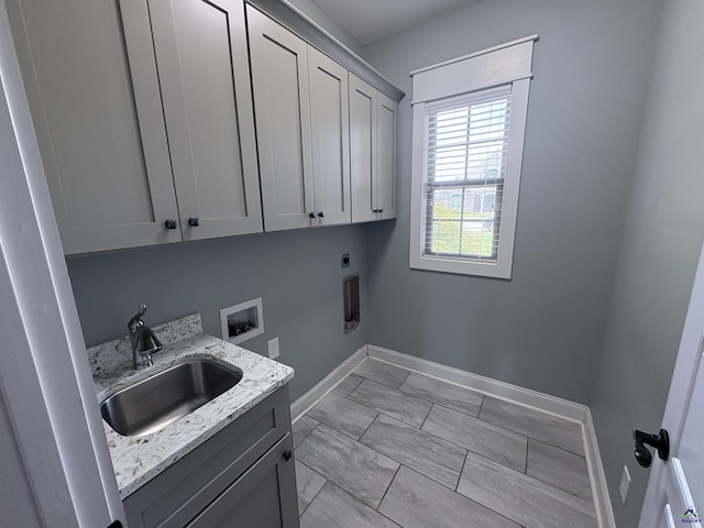 300 Stacy Ln, Warner Robins, GA 31088 - washroom featuring cabinet space, electric dryer hookup, washer hookup, and light marble finish flooring