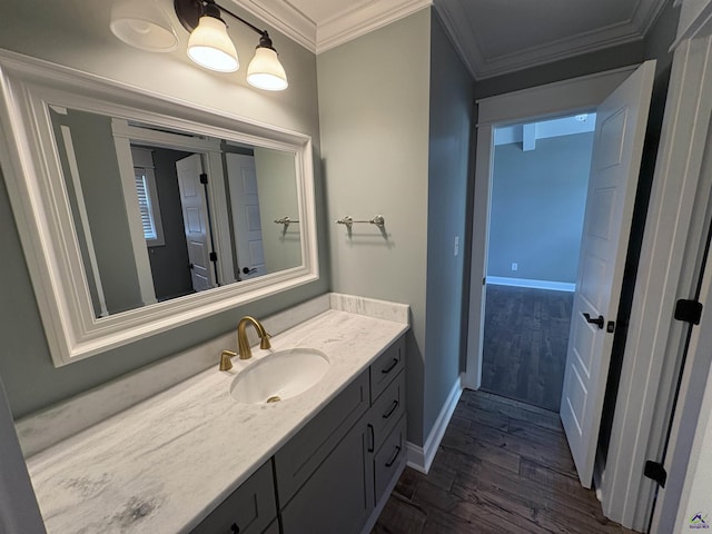 300 Stacy Ln, Warner Robins, GA 31088 - bathroom with wood finished floors, vanity, and crown molding