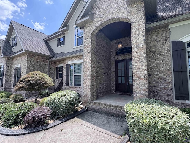 300 Stacy Ln, Warner Robins, GA 31088 - view of exterior entry with brick siding and a shingled roof