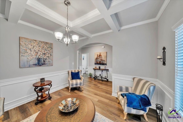 215TYNDALLWAY Tyndall Way, Perry, GA 31069 - sitting room with arched walkways, coffered ceiling, beamed ceiling, wood finished floors, and a chandelier