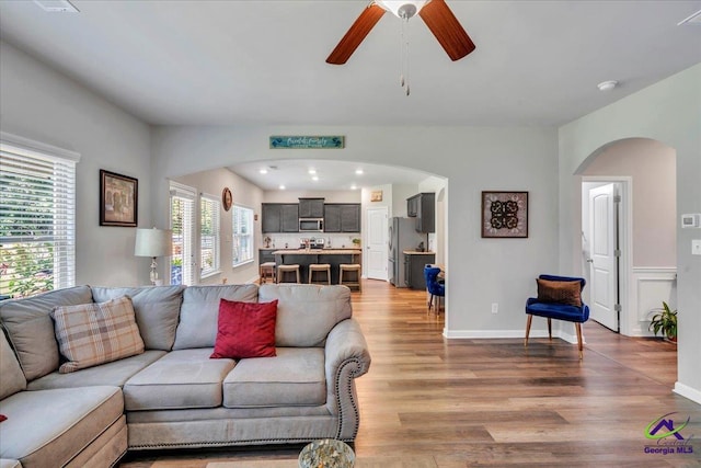215TYNDALLWAY Tyndall Way, Perry, GA 31069 - living room featuring arched walkways, a ceiling fan, light wood-style floors, and recessed lighting