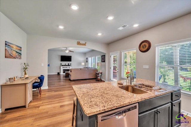 215TYNDALLWAY Tyndall Way, Perry, GA 31069 - kitchen featuring stainless steel dishwasher, arched walkways, a ceiling fan, light wood-type flooring, and recessed lighting