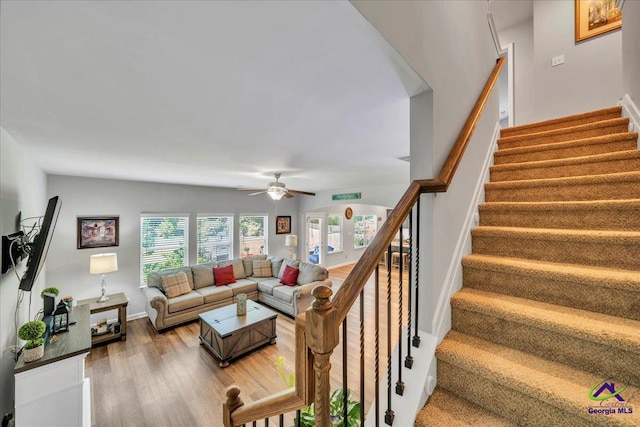 215TYNDALLWAY Tyndall Way, Perry, GA 31069 - living area with stairs, light wood finished floors, and a ceiling fan
