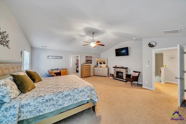 215TYNDALLWAY Tyndall Way, Perry, GA 31069 - bedroom featuring light colored carpet, vaulted ceiling, a spacious closet, and a ceiling fan