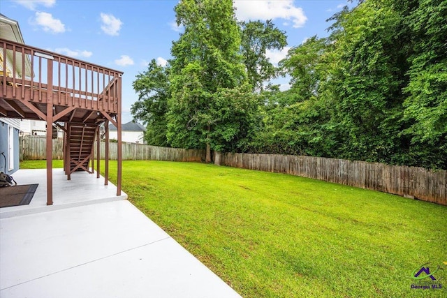 129 Sugarloaf Dr, Macon, GA 31204 - fenced backyard featuring stairway, a patio area, and a deck