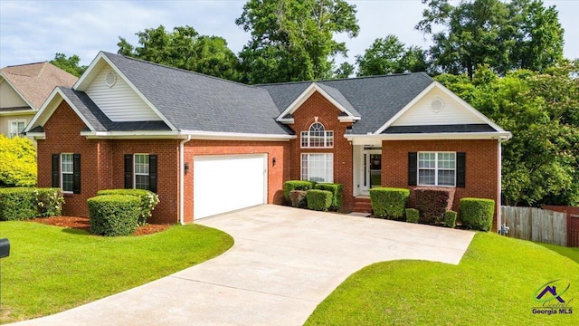 129 Sugarloaf Dr, Macon, GA 31204 - view of front of house with an attached garage, brick siding, driveway, and roof with shingles