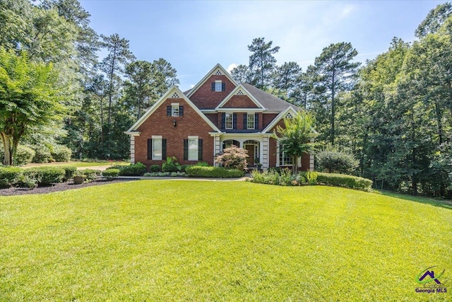 612 Remington Dr, Macon, GA 31210 - colonial house with a front lawn and brick siding