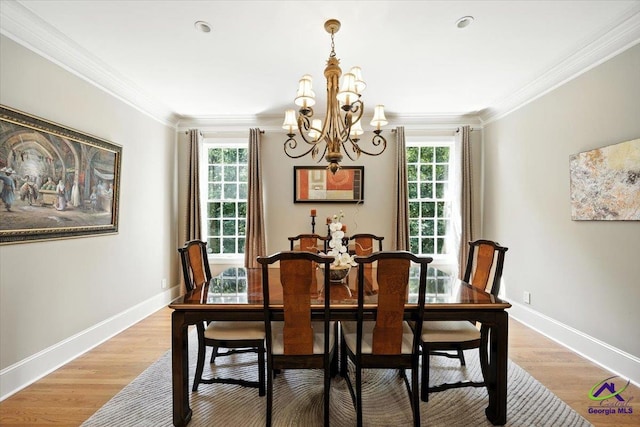 612 Remington Dr, Macon, GA 31210 - dining room with a chandelier, crown molding, and light wood-style flooring