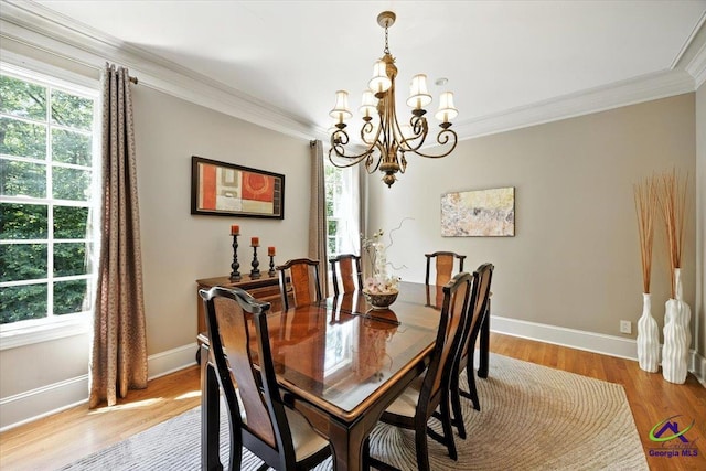 612 Remington Dr, Macon, GA 31210 - dining space with ornamental molding, a chandelier, plenty of natural light, and light wood-style flooring