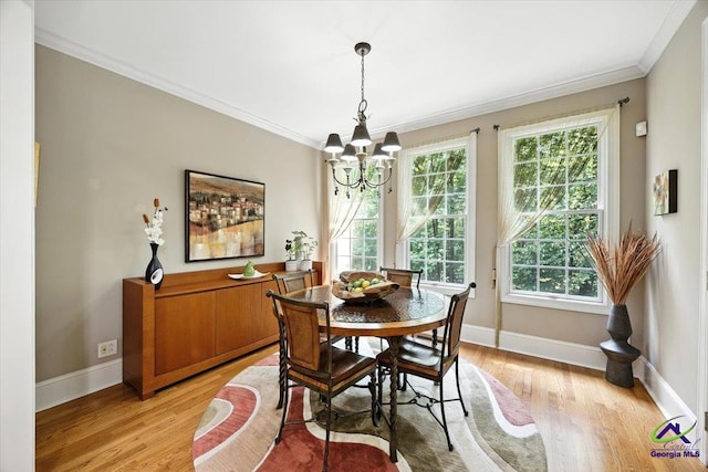 612 Remington Dr, Macon, GA 31210 - dining room featuring plenty of natural light, light wood-style floors, a chandelier, and ornamental molding