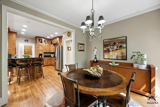 612 Remington Dr, Macon, GA 31210 - dining area with light wood-type flooring, a chandelier, ornamental molding, and recessed lighting