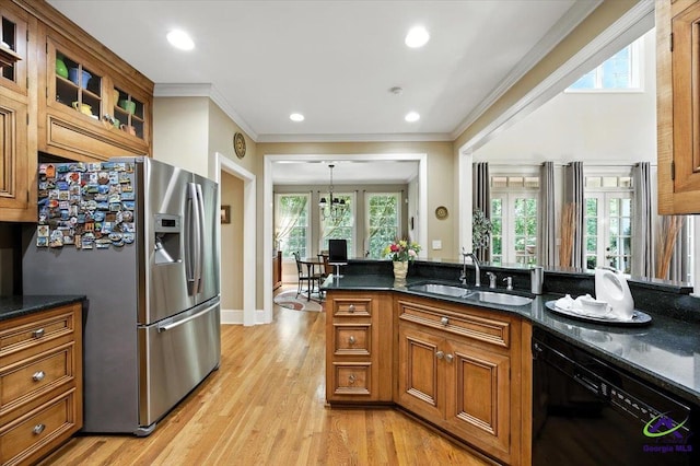 612 Remington Dr, Macon, GA 31210 - kitchen with stainless steel refrigerator with ice dispenser, black dishwasher, brown cabinets, glass insert cabinets, and light wood-style floors