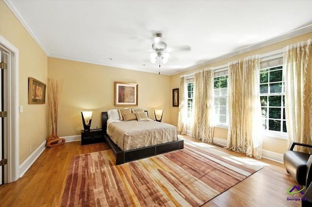 612 Remington Dr, Macon, GA 31210 - bedroom with wood finished floors, ornamental molding, and a ceiling fan