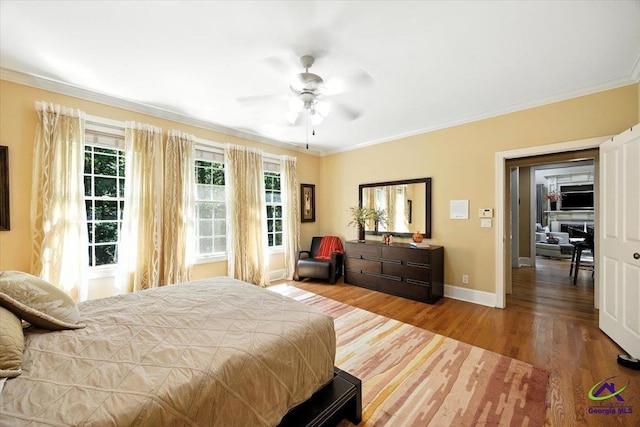 612 Remington Dr, Macon, GA 31210 - bedroom featuring crown molding, wood finished floors, and a ceiling fan