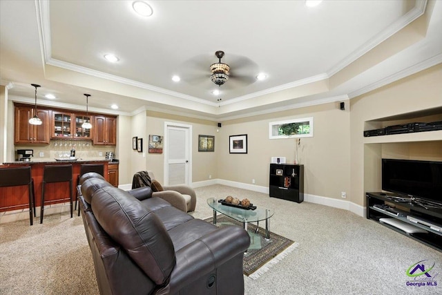 612 Remington Dr, Macon, GA 31210 - living area featuring a raised ceiling, light carpet, ornamental molding, recessed lighting, and bar with sink