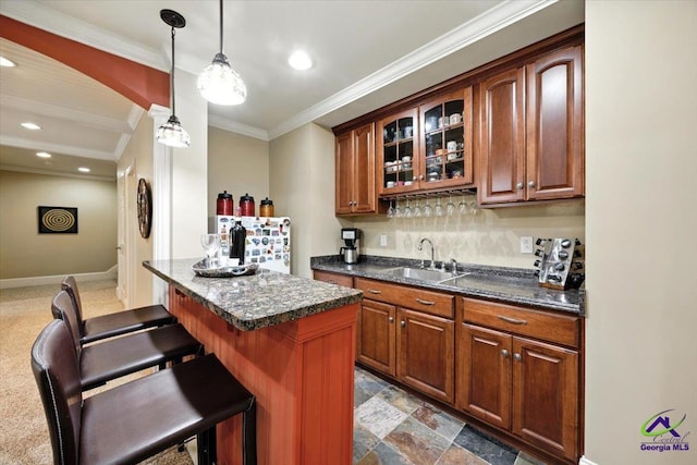 612 Remington Dr, Macon, GA 31210 - indoor wet bar with ornamental molding, hanging light fixtures, recessed lighting, and decorative backsplash