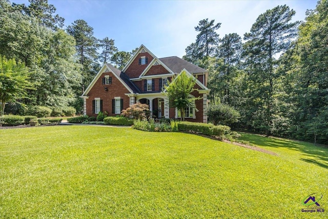 612 Remington Dr, Macon, GA 31210 - colonial inspired home featuring a front lawn and brick siding