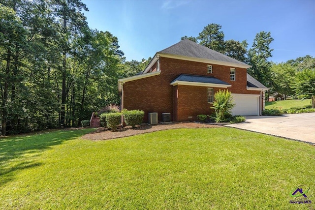 612 Remington Dr, Macon, GA 31210 - view of side of property featuring driveway, brick siding, a garage, and a lawn