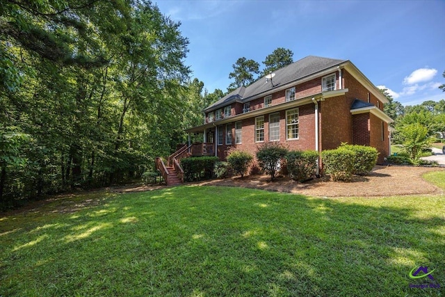 612 Remington Dr, Macon, GA 31210 - rear view of property featuring a yard, brick siding, and stairs