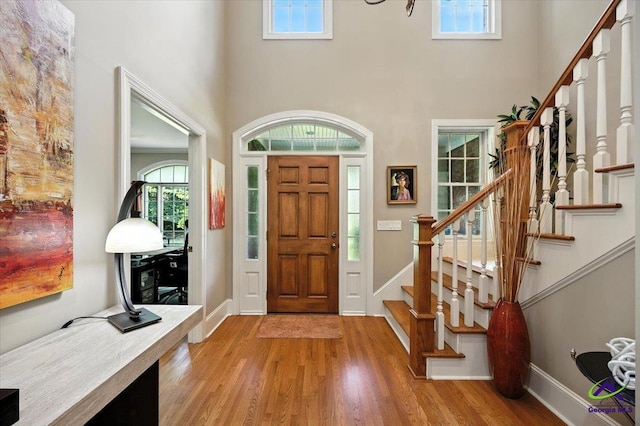 612 Remington Dr, Macon, GA 31210 - foyer entrance with a high ceiling, stairs, and light wood-style floors