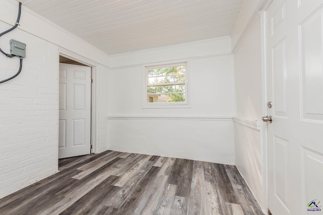 4354 Pio Nono Ave, Macon, GA 31206 - unfurnished room featuring wood finished floors, ornamental molding, and brick wall
