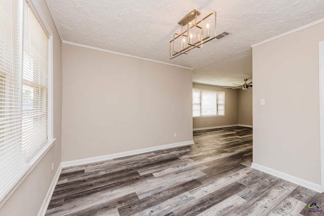 4354 Pio Nono Ave, Macon, GA 31206 - spare room with wood finished floors, a textured ceiling, a chandelier, and crown molding