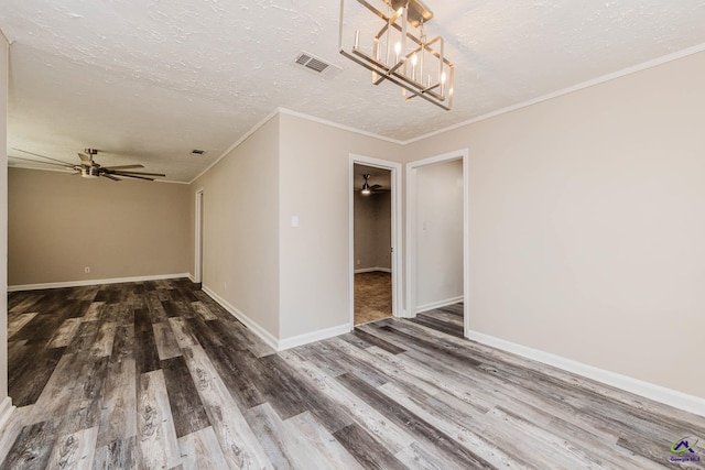 4354 Pio Nono Ave, Macon, GA 31206 - spare room with wood finished floors, a chandelier, a textured ceiling, crown molding, and ceiling fan