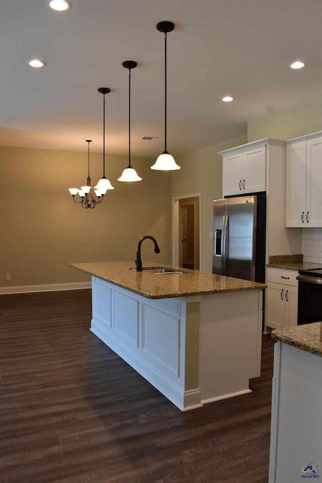 116 Sasanqua Dr, Warner Robins, GA 31088 - kitchen with stainless steel refrigerator with ice dispenser, dark wood-style floors, white cabinetry, a center island with sink, and recessed lighting