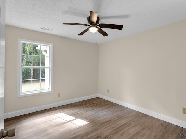 434 Barnes Rd, Jackson, GA 30233 - empty room featuring wood finished floors, plenty of natural light, and ceiling fan