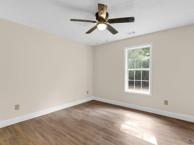 434 Barnes Rd, Jackson, GA 30233 - empty room with wood finished floors and ceiling fan