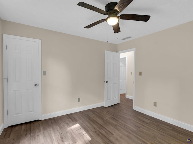 434 Barnes Rd, Jackson, GA 30233 - unfurnished bedroom featuring wood finished floors and ceiling fan