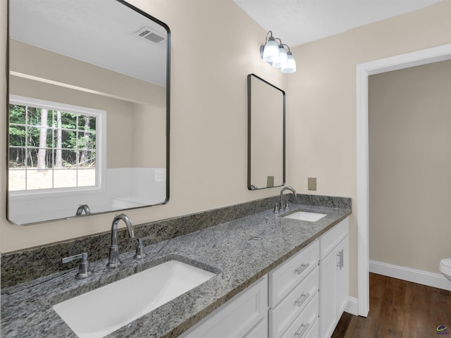 434 Barnes Rd, Jackson, GA 30233 - bathroom featuring double vanity and wood finished floors