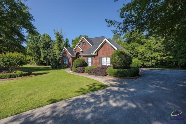 208 W Troon, Macon, GA 31210 - traditional home featuring a front yard and brick siding