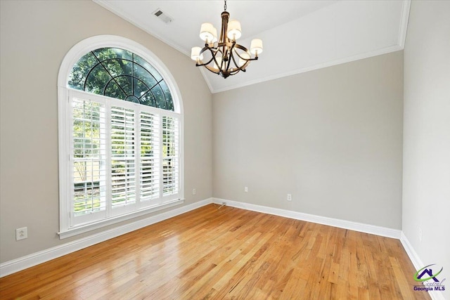 208 W Troon, Macon, GA 31210 - spare room featuring plenty of natural light, a chandelier, light wood finished floors, crown molding, and vaulted ceiling
