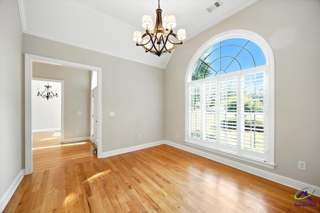 208 W Troon, Macon, GA 31210 - spare room featuring a chandelier, ornamental molding, light wood-style flooring, and lofted ceiling