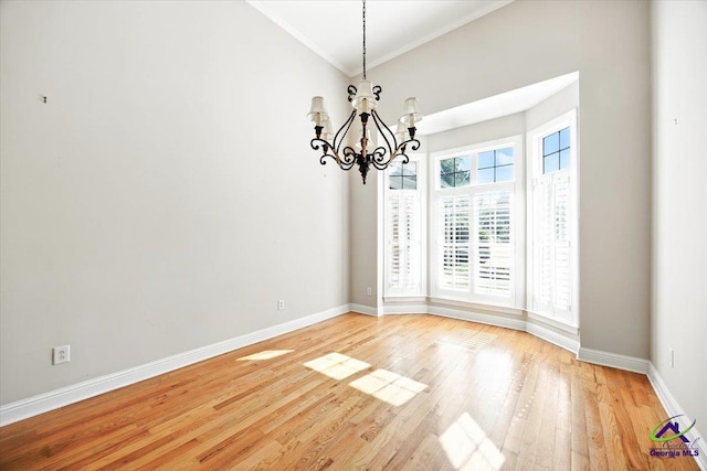 208 W Troon, Macon, GA 31210 - unfurnished dining area featuring crown molding, a chandelier, and light wood-style flooring