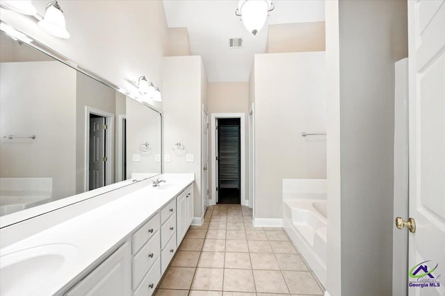 208 W Troon, Macon, GA 31210 - bathroom featuring a bath, double vanity, and tile patterned floors